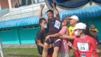 ANDRE AGASI ATLIT BERBADAN GEMUK  PERAIH MEDALI EMAS LARI 400 M  TUNA NETRA T11