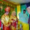 Pj. Bupati Aceh Tamiang, Drs. Meurah Budiman, SH, MH, dan Ketua TP-PKK, Zuraidah Meurah saat mengikuti prosesi penabalan gelar adat Datok Setie Amanah dan Datin Setie Amanah yang ditandai dengan pemasangan Tengkulok, Tumbok Lada dan Tudong, di Kampung Sei Liput, Kejuruan Muda, Sabtu (14/1/2023).